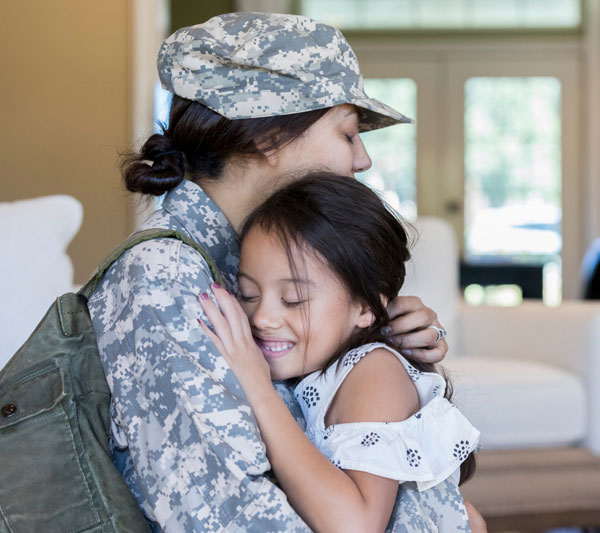 veteran hugging her daughter