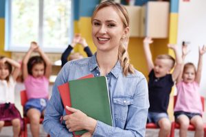 franchise candidates - Smiling female teacher in the preschool